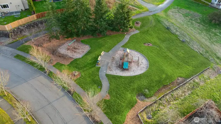 Steps to the small toddler's park a few doors down