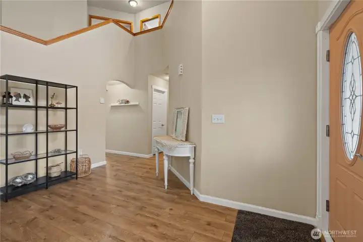 Open balcony, vaulted ceilings and foyer area.