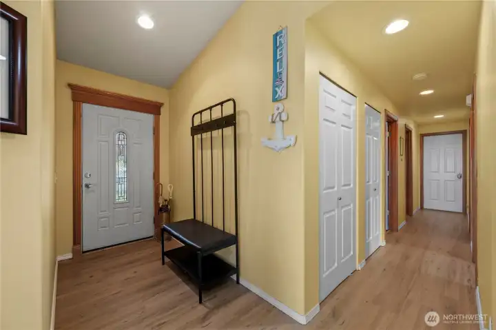Entryway and hallway leading to all bedrooms