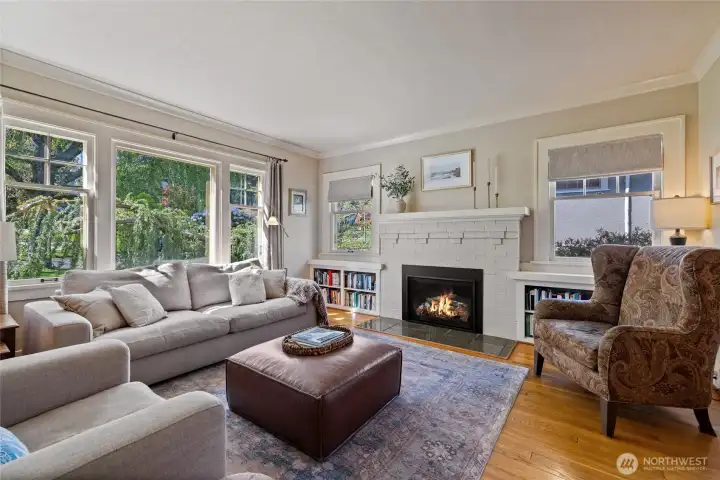 Large windows out front keep the room bright all year.