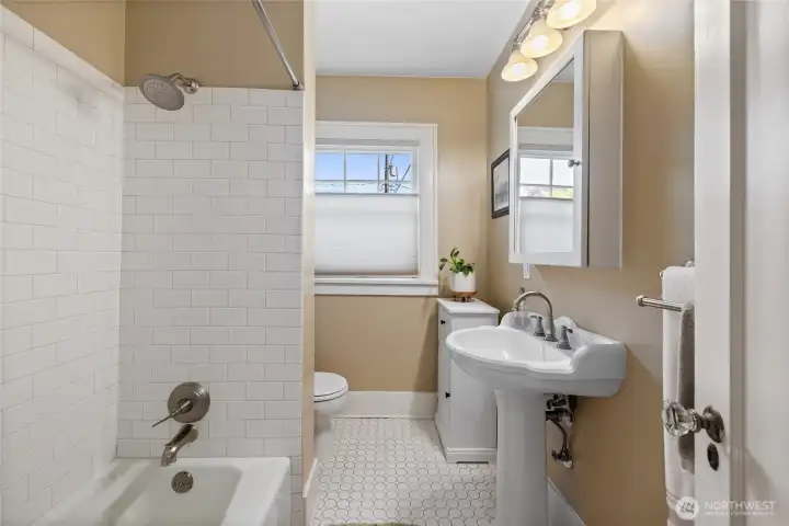 Full bathroom on the main floor.  Tile floor & tile tub surround.