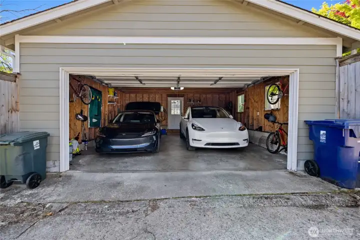 Two car garage with level 2 EV charger & subpanel in place, installed in 2024.