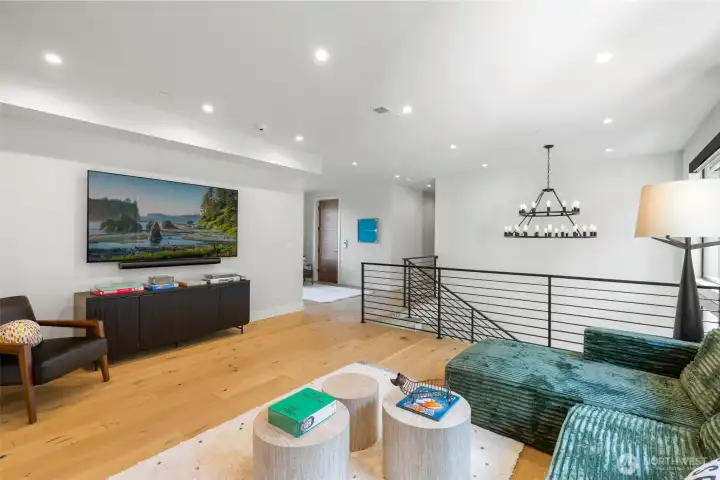 Upper level media/play space (with library) at the nexus of four bedrooms (and laundry...but there's also and "activities" laundry set-up in the 3-car garage).
