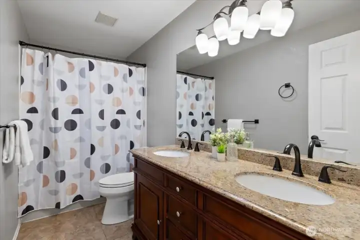 Full guest bathroom with Granite counters and dual vanity. Warm cabinetry and fixtures... a very tasteful guest bathroom! Full guest bathroom with Granite counters and dual vanity. Warm cabinetry and fixtures... a very tasteful guest bathroom!