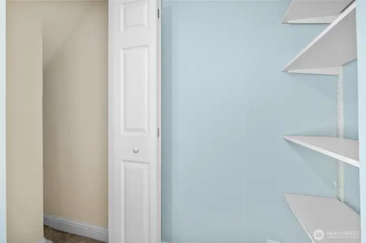 small closet and shelving in 3rd bedroom. small closet and shelving in 3rd bedroom.