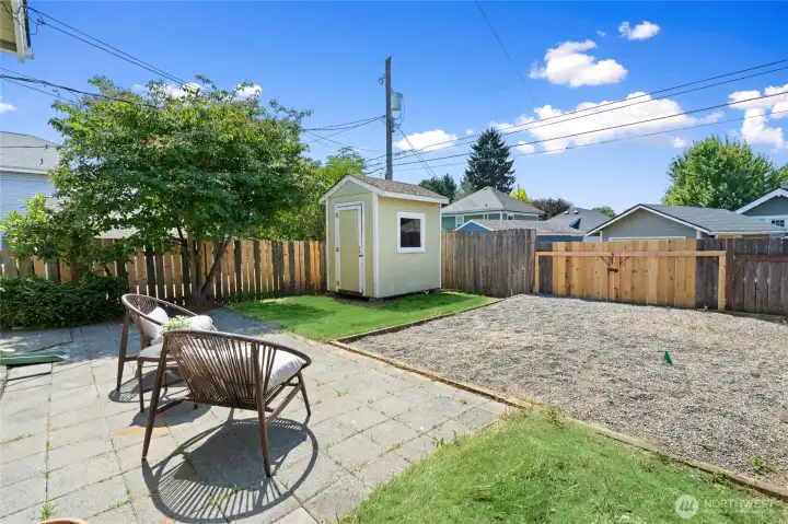 Back yard, fully-fenced. Access also through alley. Storage shed is perfectly sized for your outdoor stuff. Back yard, fully-fenced. Access also through alley. Storage shed is perfectly sized for your outdoor stuff.