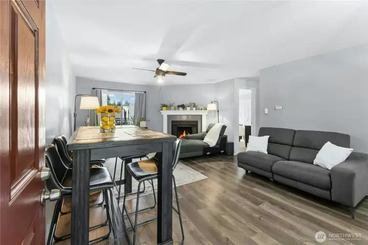 Large dining and living room with new light fixtures