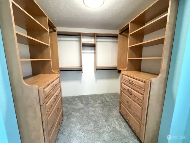 Primary Walk in closet with custom shelving