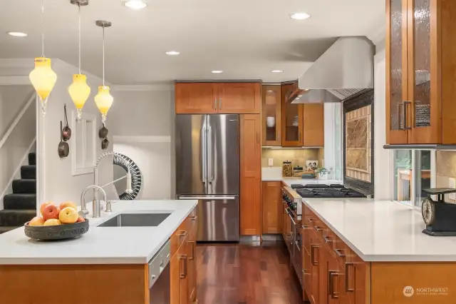 Beautiful wood cabinetry accent the new quartz countertops.