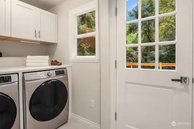 Custom laundry area with access to the deck.