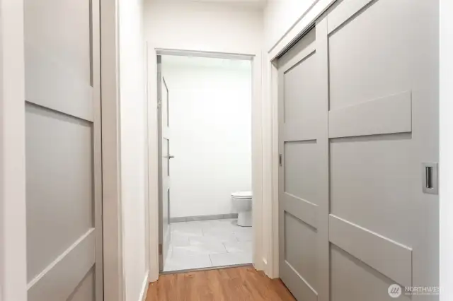 Hallway entry to half bathroom.