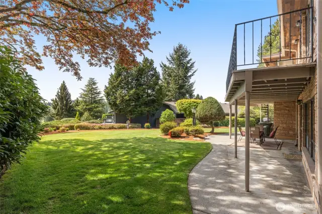 Large private backyard with upper and lower patios