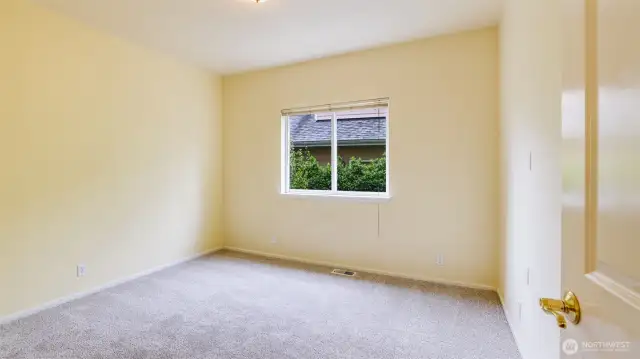 Enjoy main floor living with this spacious guest bedroom - great for multi-gen living, home office, guest room, etc.