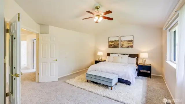 Enter the serene primary suite through stylish double doors that adds uniqueness to the space