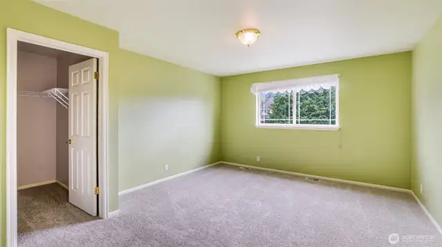 Upstairs guest bedroom #3 features a walk-in closet—ideal for guests or extra storage space
