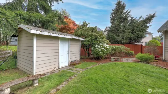 Backyard includes a handy storage shed- useful for any tools or yard equipment