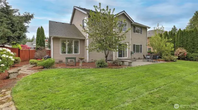Spacious backyard with an open layout, providing flexibility for gardening, play, entertaining, and more