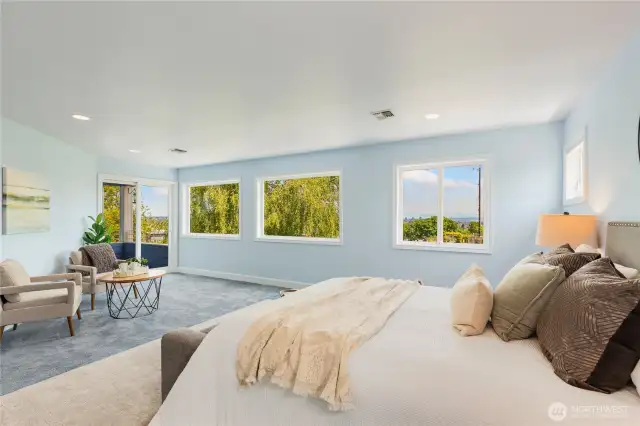 The light and airy Primary Suite offers incredible views, and abundant space.