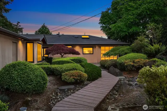 Beautifully manicured Japanese garden in the front.