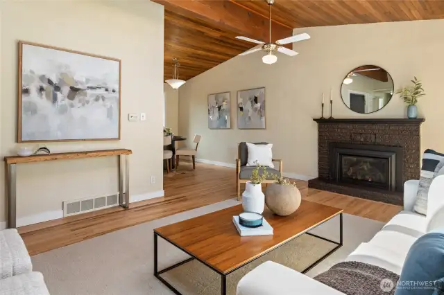 Living room with vaulted ceilings and skylights
