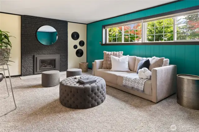 Lower level rec room with plenty of natural light and gas firepalce
