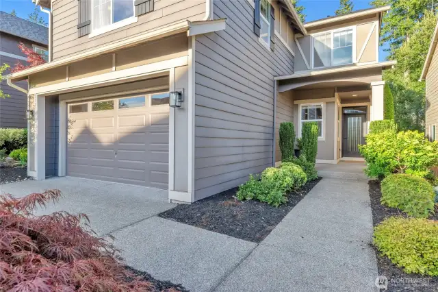 Easy, low maintenance landscaping leads to the new front door