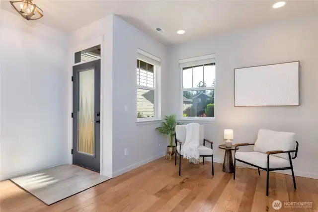 This new front door and updated lighting fixtures make this charming nook and entryway a welcoming area right when you walk in.