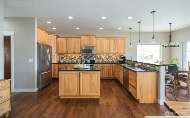 Tons of cabinets and a large prep island in the chef's kitchen.