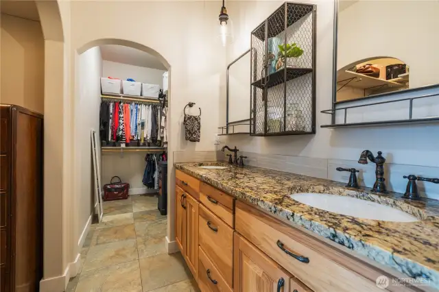 Two closets, dual sinks and a large vanity.