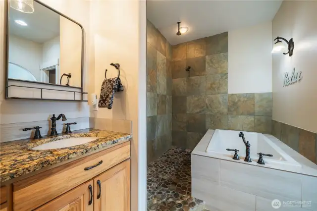 Here is the soaking tub and double head shower.