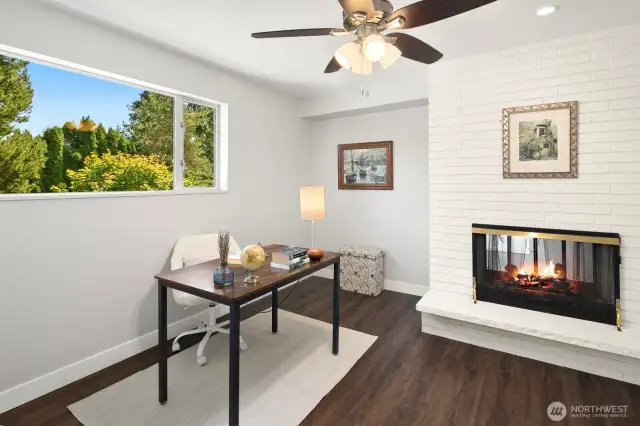 Main primary suite with attached office and gas fireplace