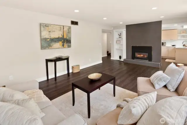 Lower recreation room with gas fireplace