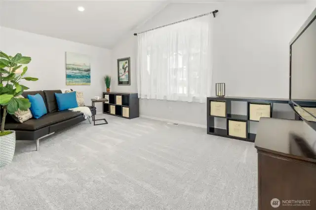 Family Room Featuring Vaulted Ceilings