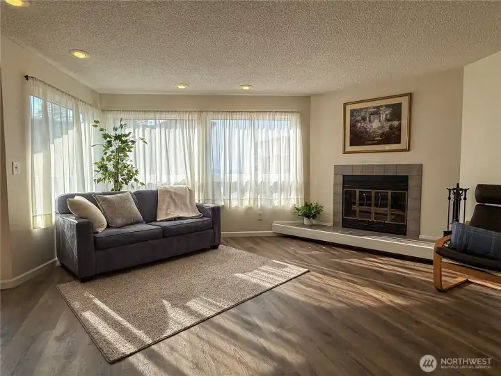 Warm and inviting living room is filled with natural light.