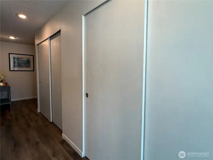 The entry hallway offers a large coat closet and plenty of storage with a pantry area.