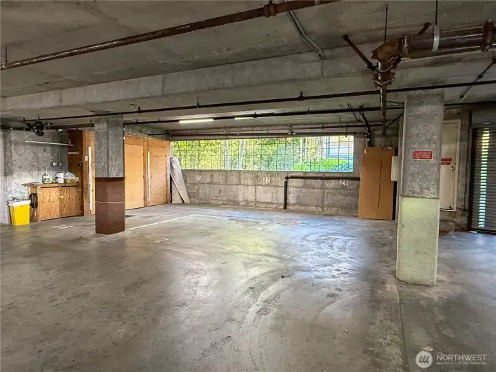 A great little work area to the right and 3 locked storage units are yours.