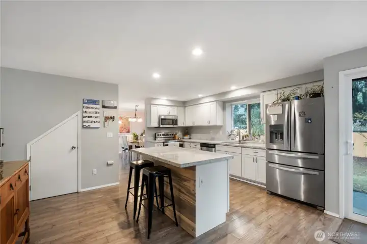 Totally OPEN CONCEPT kitchen is perfect for entertaining. Note: Microwave shown has been replaced with SS Hood.