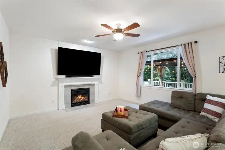 Large Family Room with gas fireplace. TV stays with home.