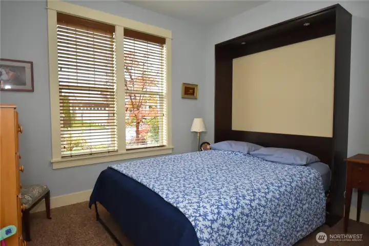 Murphy Bed that folds up and allows use of the extra space.