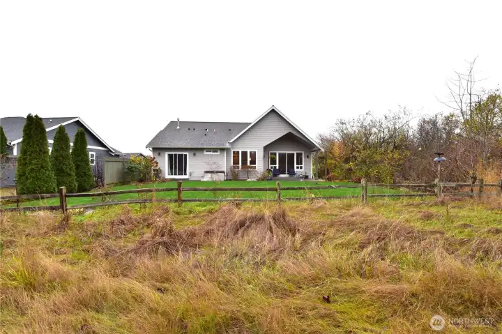 Adjacent to a green belt for added privacy.