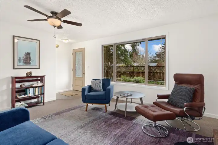 Enter through the front door into the living room space. Freshly painted.