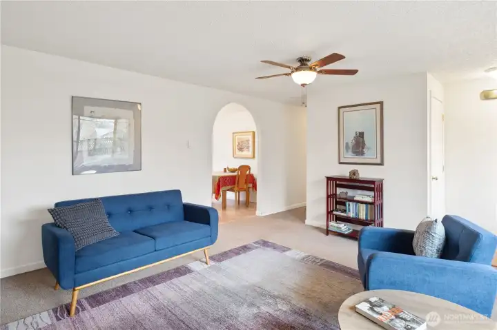 In this photo you can see the hall closet, hall to the bedrooms and baths and arched entry to the dining and kitchen area.