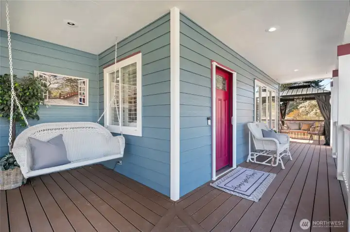 An inviting covered front porch and peek at the gazebo and outdoor oasis later in the photos!