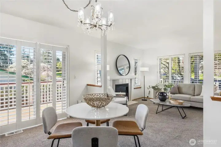 Dining area flows seamlessly to the outdoors to enjoy this lovely spring days! Plantation shutters throughout main level.