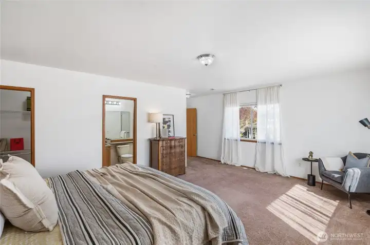 Primary suite (one of two!) includes private bath & walk in closet.