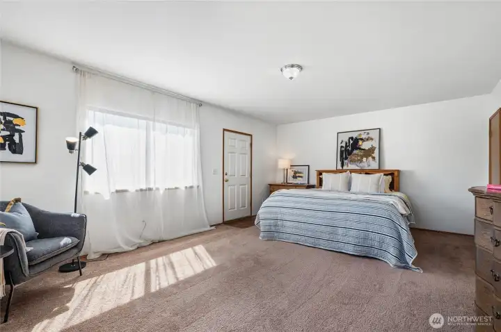 This spacious upper-level primary also includes an exterior door - great for multi-gen living flexibility.