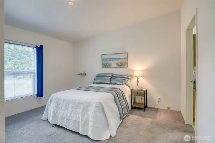 Primary suite with walk-in closet and private full bath