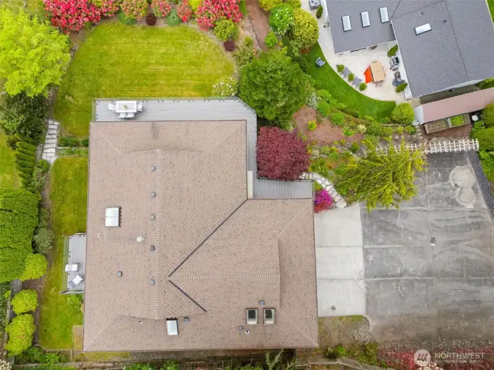 Exterior abounds with gorgeous plants and privacy.  Note the extra parking area.