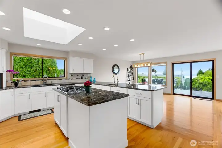 Newly remodeled kitchen has anabundance of counter space and cabinets.  A chef's delight with gas cooktop, prep sink, granite counters.  Oh, and views!