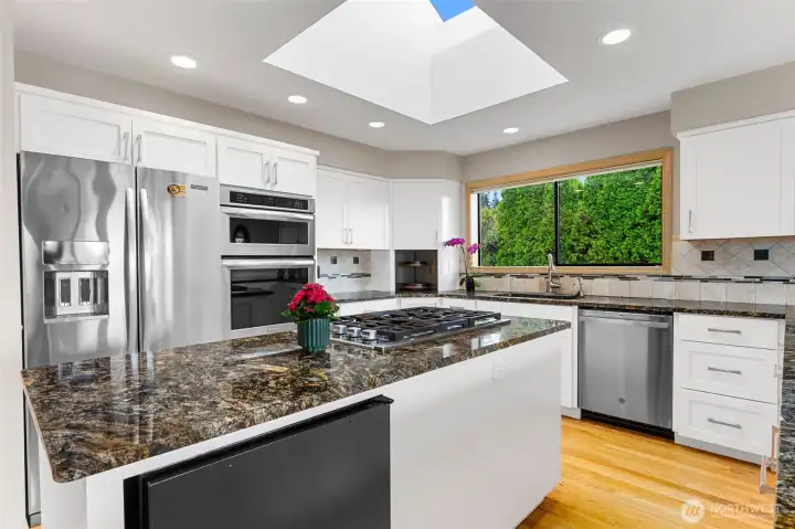 Stainless appliances plus a wine fridge.
